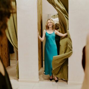 Woman Opening Fitting Room