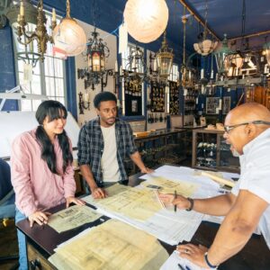 Wide shot of a Team of architects working in the studio on a home renovation project